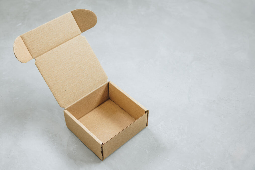 Paper Box. Brown paper Box. Brown cardboard box on gray backgrou