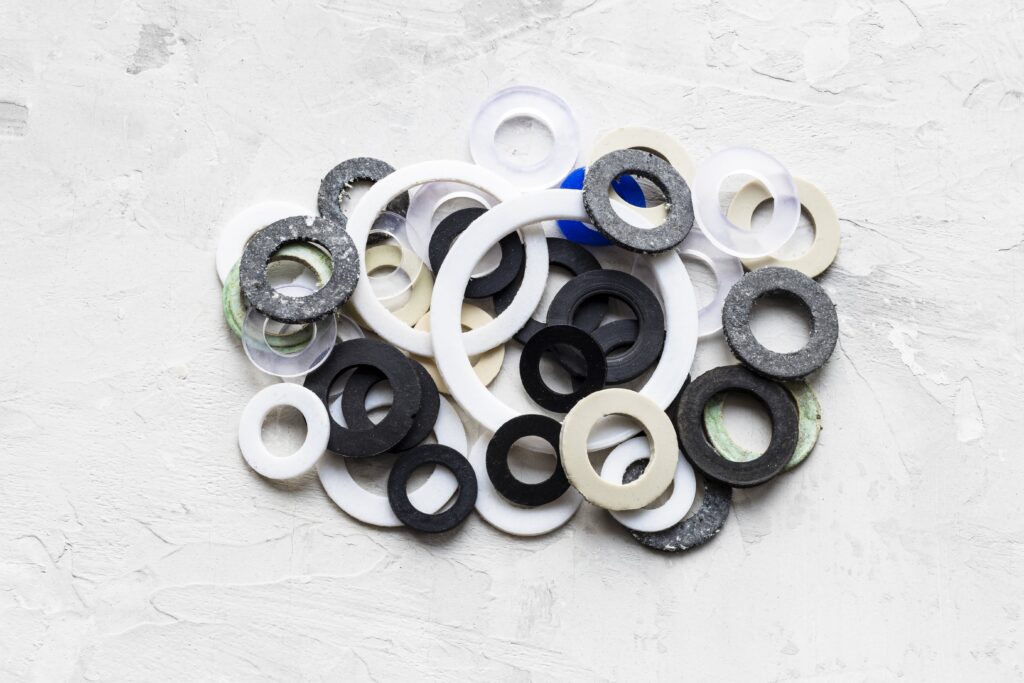 pile-of-various-gaskets-for-plumbing-water-systems-min